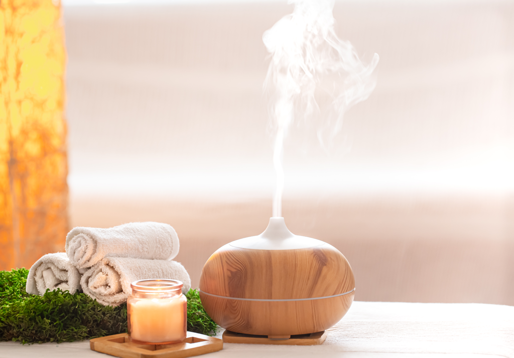 spa composition with aroma modern oil diffuser with body care products - Guardian Clinic